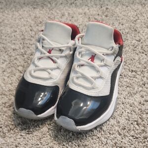 Nike Air Jordan Retro 11 Black and White Sneakers with Red Accents